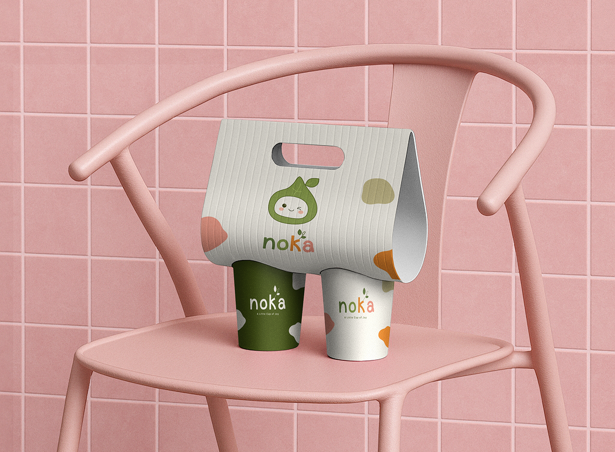 Noka takeaway carrier box and cups on a pink tiled chair
